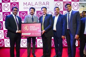Mr. Najeeb K, Regional Head of Malabar Gold, Bollywood actor Anil Kapoor and Mr. Boban during the launch of a Gold Investment Scheme in a tie-up with Malabar Gold and Diamonds in Muscat.
